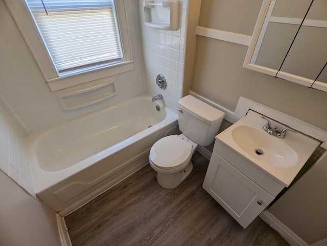 full bathroom with hardwood / wood-style flooring, vanity, toilet, and bathing tub / shower combination