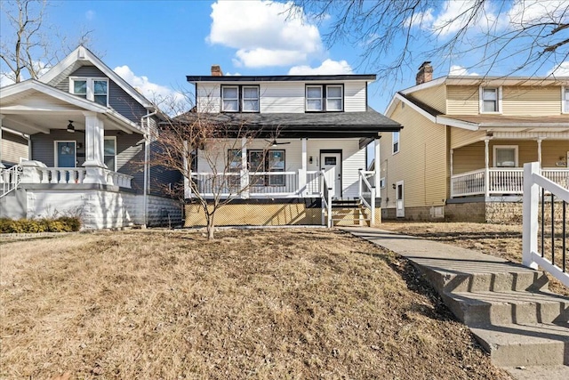 view of front of home featuring a porch and a front yard