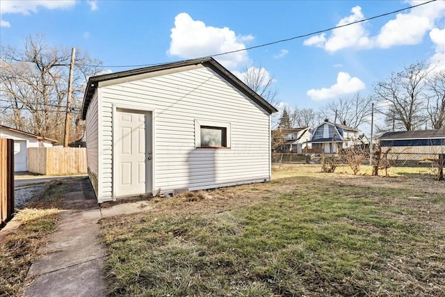 view of outdoor structure featuring a lawn