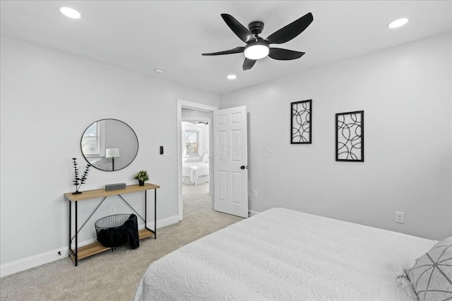 bedroom featuring light colored carpet and ceiling fan