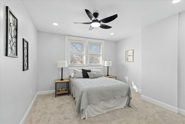 bedroom with light carpet and ceiling fan