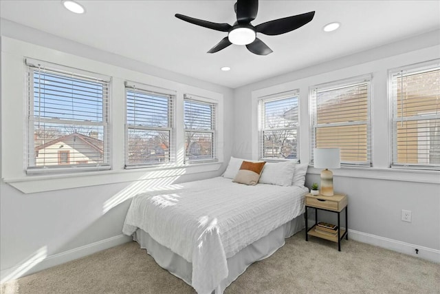 carpeted bedroom featuring ceiling fan