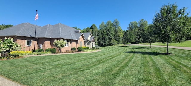 view of side of property with a yard