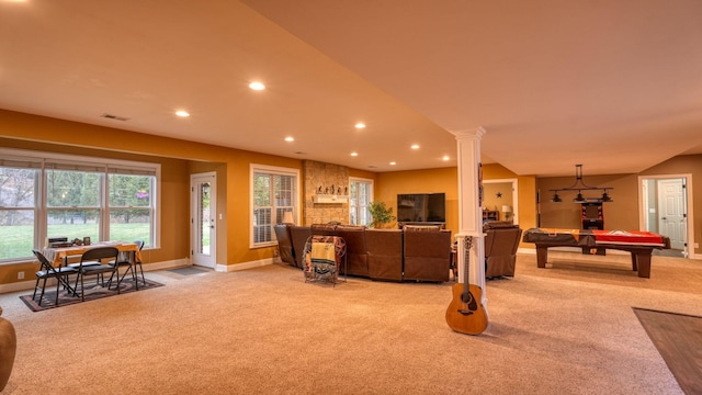 living room with light carpet, pool table, and decorative columns