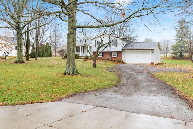 view of front of home with a garage and a front yard