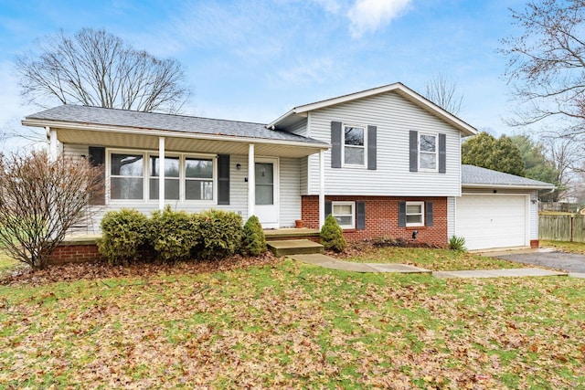 split level home with a garage and a front yard