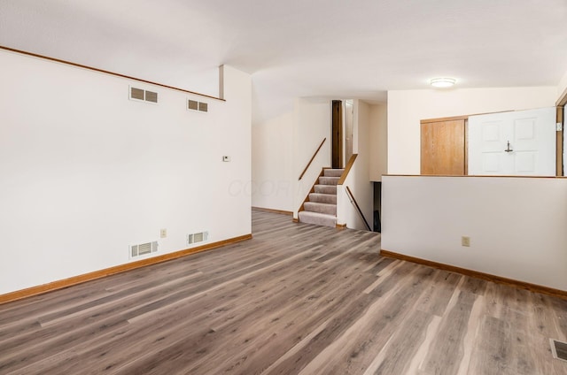 spare room featuring dark wood-type flooring