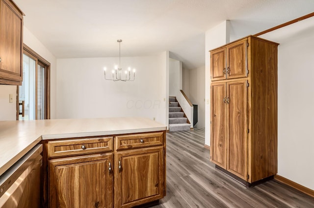 kitchen with dishwasher, dark hardwood / wood-style floors, decorative light fixtures, kitchen peninsula, and a chandelier