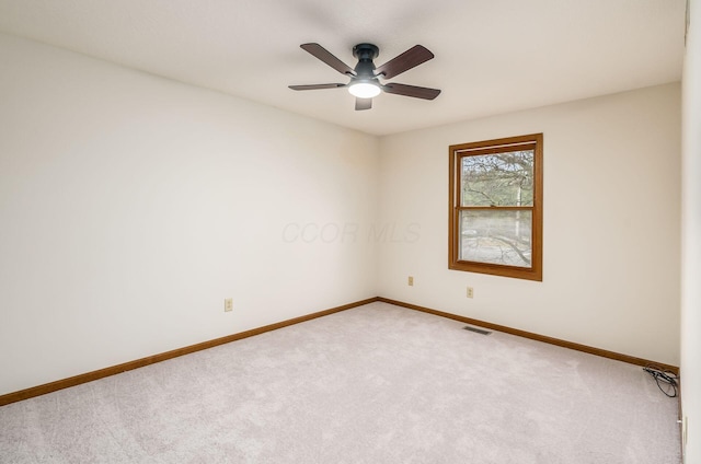 carpeted empty room with ceiling fan