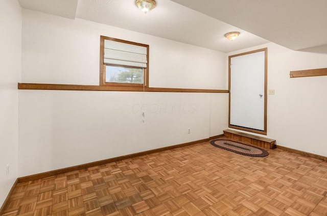 empty room with light parquet flooring