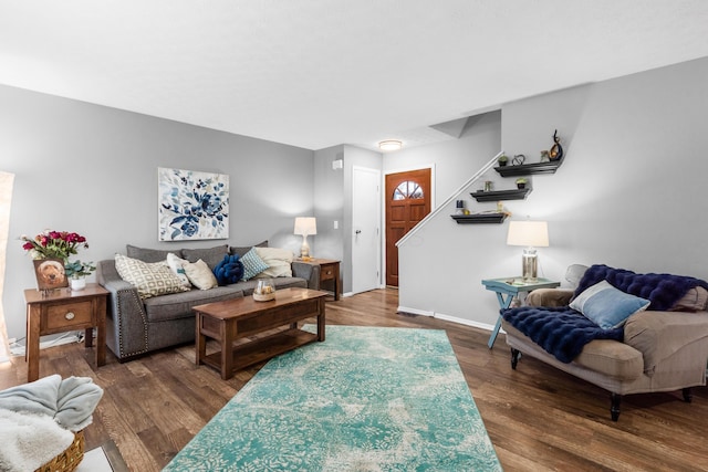 living room featuring dark wood-type flooring