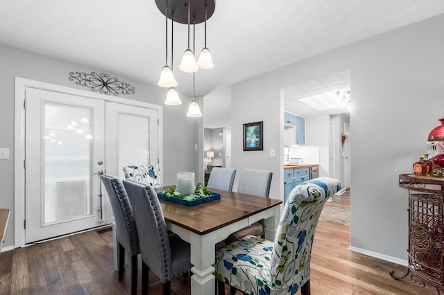 dining space with light hardwood / wood-style flooring