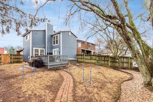 rear view of house featuring a deck