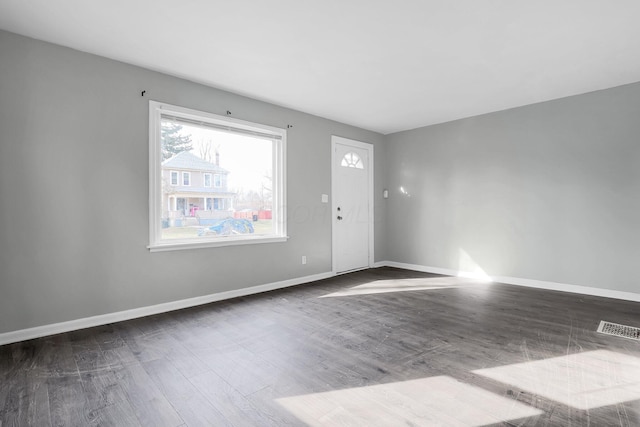 unfurnished room featuring dark hardwood / wood-style flooring