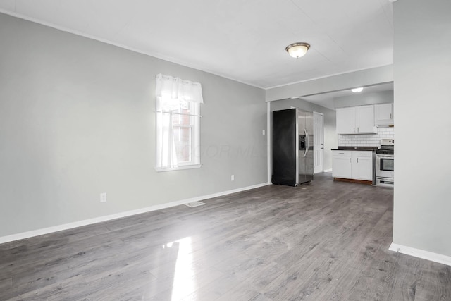 unfurnished living room with hardwood / wood-style flooring