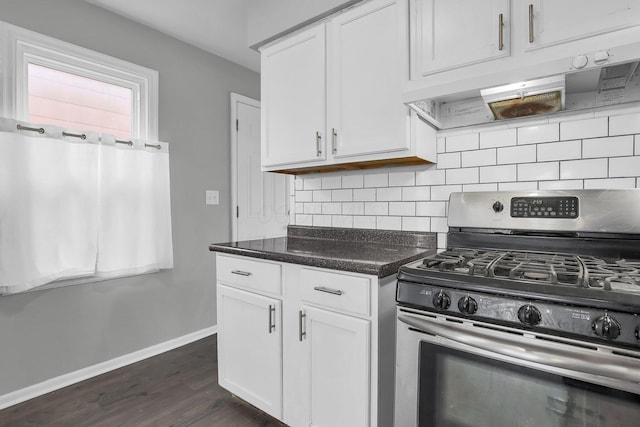 kitchen featuring white cabinetry, stainless steel gas range oven, tasteful backsplash, and dark hardwood / wood-style flooring