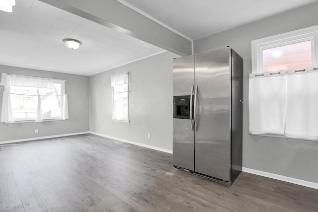 kitchen with dark wood-type flooring and stainless steel refrigerator with ice dispenser