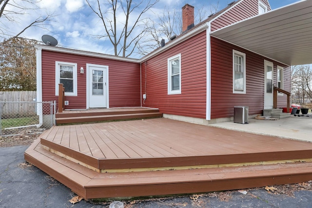 wooden terrace with a patio