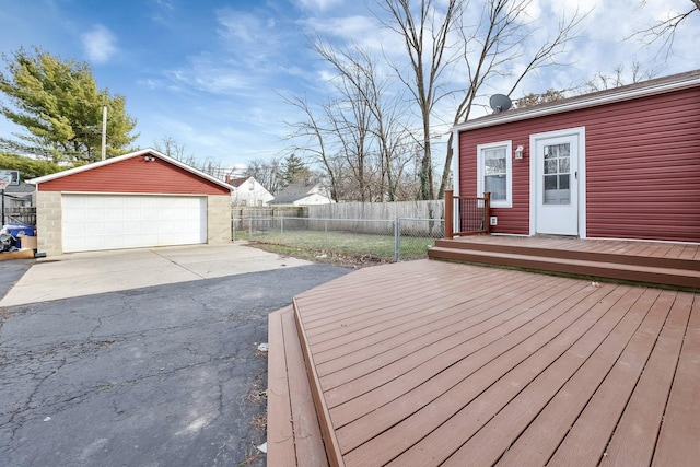 deck with a garage and an outdoor structure