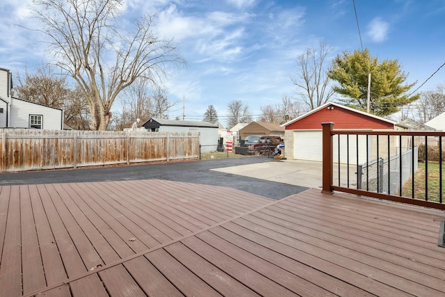 deck featuring a garage and an outdoor structure