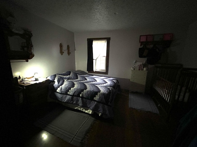 bedroom featuring a textured ceiling