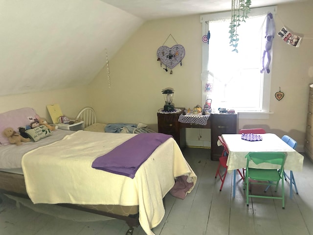 bedroom with lofted ceiling