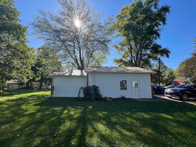 view of outdoor structure with a yard