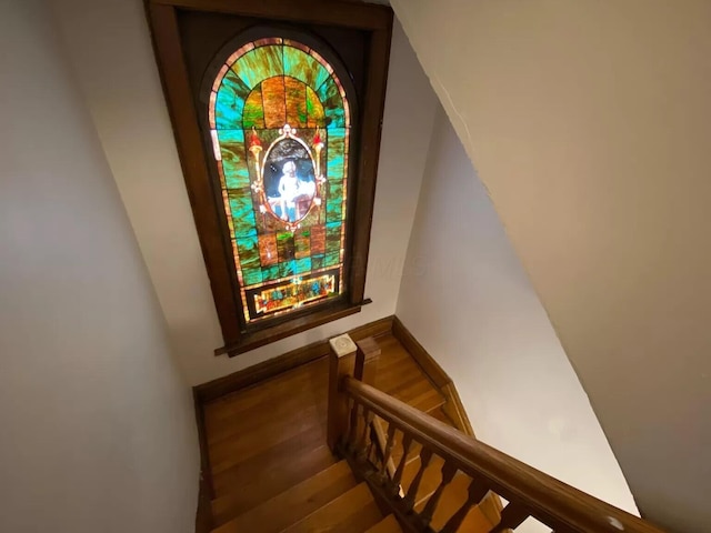 stairway with wood-type flooring