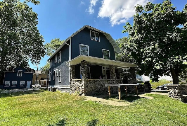 view of front of house with a front lawn and central air condition unit