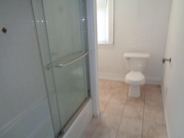 bathroom featuring tile patterned floors and toilet