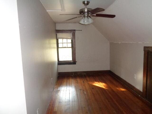 bonus room featuring lofted ceiling, dark wood-type flooring, and ceiling fan