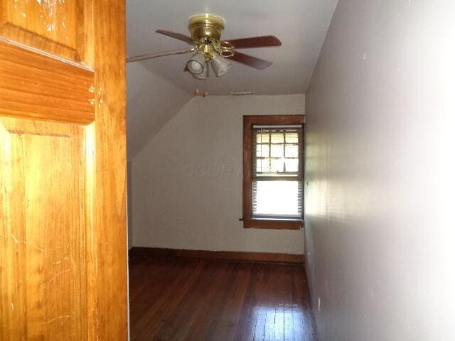 bonus room featuring lofted ceiling, dark wood-type flooring, and ceiling fan