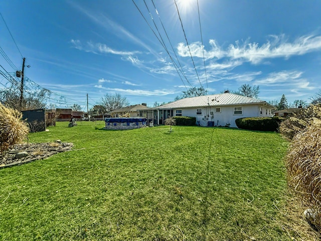 view of yard featuring a fenced in pool