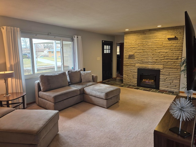 carpeted living area with recessed lighting, a fireplace, and baseboards