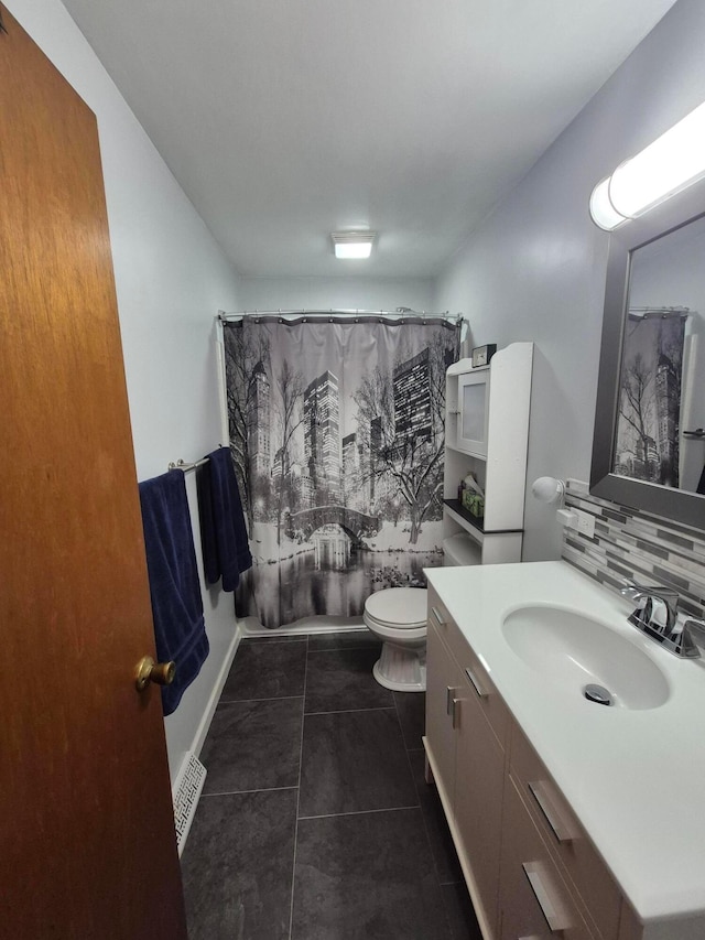 bathroom with toilet, curtained shower, tile patterned flooring, vanity, and backsplash