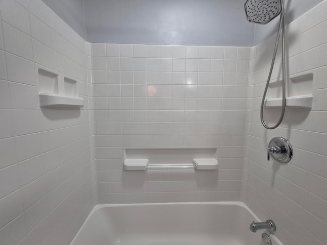 bathroom with shower / washtub combination