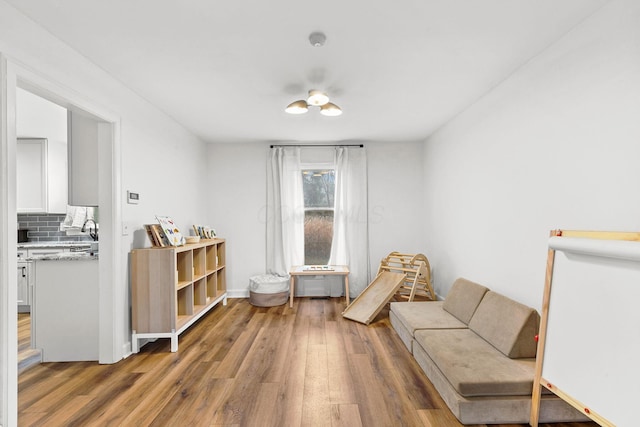 sitting room with light wood-type flooring