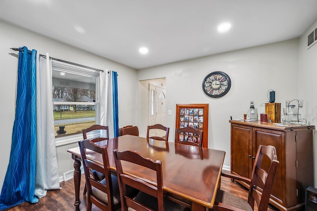 dining space featuring dark hardwood / wood-style floors