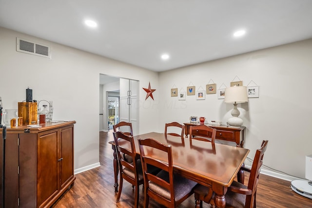 dining area featuring dark hardwood / wood-style floors