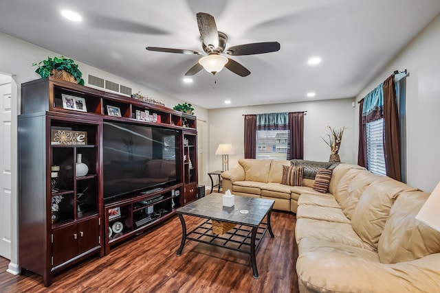 living room with dark hardwood / wood-style floors and ceiling fan