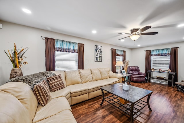 living room with dark wood-type flooring and ceiling fan