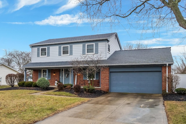 view of property with a garage, a front lawn, and covered porch