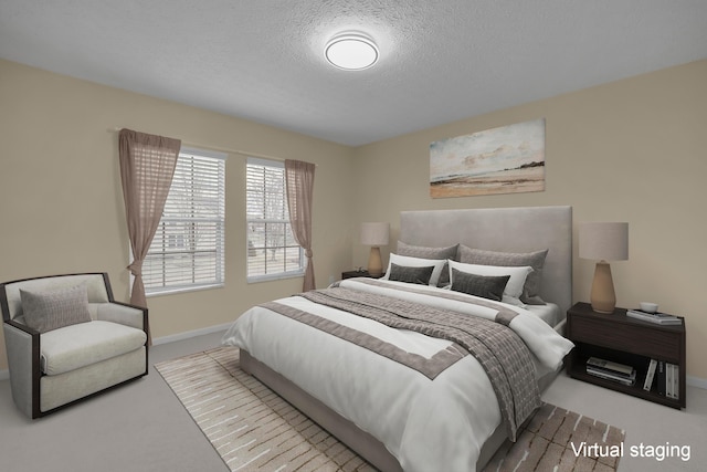 bedroom featuring a textured ceiling and carpet