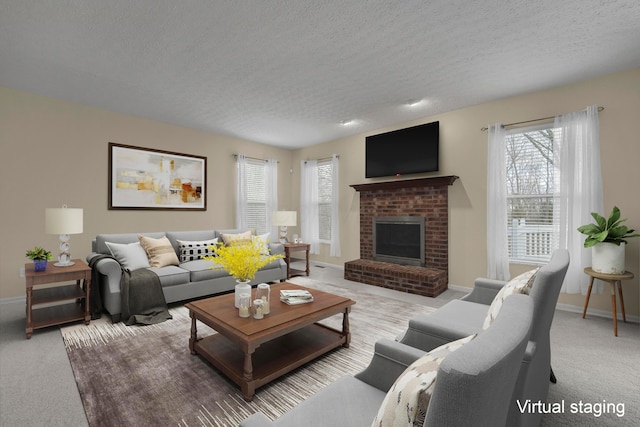 living room with light colored carpet, a fireplace, and a textured ceiling