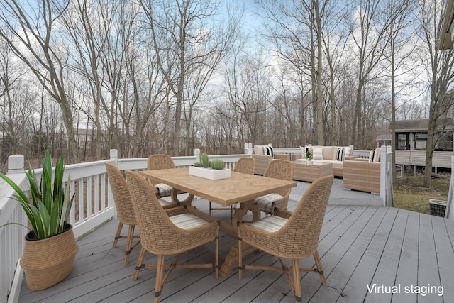 wooden terrace with outdoor lounge area