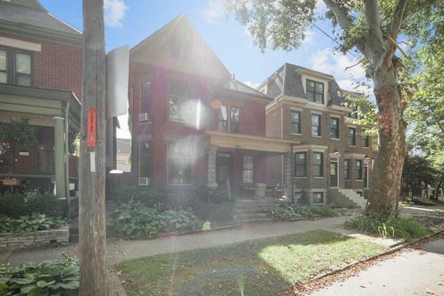 view of front of home featuring brick siding