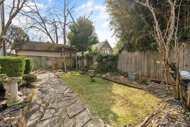 view of yard featuring a fenced backyard