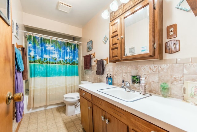 full bathroom featuring vanity, toilet, and shower / tub combo