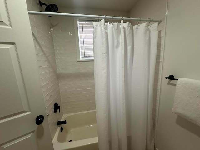 bathroom featuring shower / bath combination with curtain