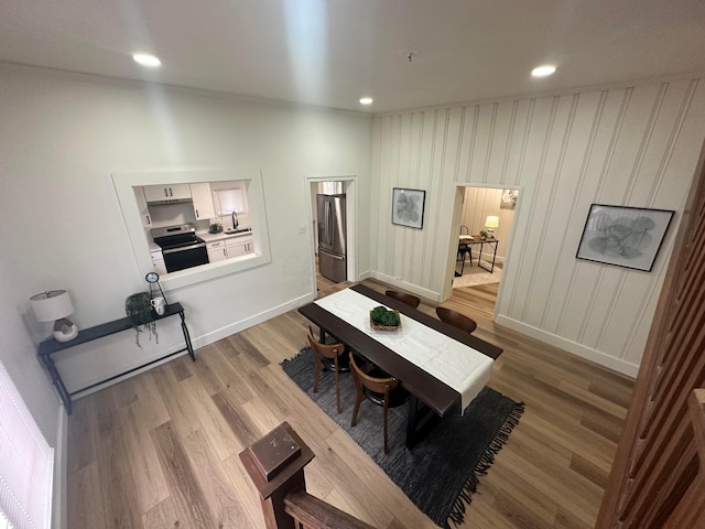 dining room with hardwood / wood-style floors